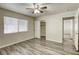 This bedroom offers wood-look floors, neutral walls, and a closet for ample storage at 5132 Springland St, Las Vegas, NV 89146