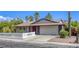 A charming single-story home featuring desert landscaping and a spacious two-car garage at 5132 Springland St, Las Vegas, NV 89146