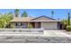 Charming single-story home with a white picket fence and desert landscaping at 5132 Springland St, Las Vegas, NV 89146