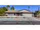 Charming single-story home with a two-car garage and unique fence at 5132 Springland St, Las Vegas, NV 89146