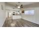 Inviting kitchen featuring granite countertops, a ceiling fan and modern appliances at 5132 Springland St, Las Vegas, NV 89146