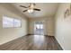 Spacious living room with sliding glass doors and wood-look flooring at 5132 Springland St, Las Vegas, NV 89146