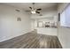 Open living room showcases a breakfast bar, kitchen, and wood-look flooring at 5132 Springland St, Las Vegas, NV 89146