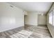 Spacious living room features modern light fixtures and wood-look flooring at 5132 Springland St, Las Vegas, NV 89146