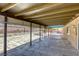 The covered patio showcases a stone floor and an outdoor fireplace at 5132 Springland St, Las Vegas, NV 89146