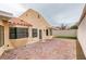 Spacious backyard patio featuring brick pavers and tasteful landscaping at 5151 Tennis Ct, Las Vegas, NV 89120