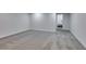 Open basement area with neutral decor and carpet flooring at 5151 Tennis Ct, Las Vegas, NV 89120