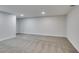 Spacious basement with modern lighting and carpet flooring at 5151 Tennis Ct, Las Vegas, NV 89120