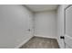 Bedroom featuring plush gray carpet and white trim with classic paneled doors at 5151 Tennis Ct, Las Vegas, NV 89120