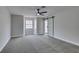 Bright bedroom with stylish sliding door, fan, and soft carpet at 5151 Tennis Ct, Las Vegas, NV 89120