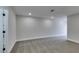 Carpeted bedroom provides a neutral palette, recessed lighting, and ample space for relaxation at 5151 Tennis Ct, Las Vegas, NV 89120