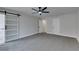 Bedroom featuring a sleek sliding door and neutral decor at 5151 Tennis Ct, Las Vegas, NV 89120