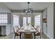 Staged dining room featuring ample natural light and seating for eight at 5151 Tennis Ct, Las Vegas, NV 89120