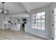 Stylish kitchen with gray cabinets, stainless steel appliances, a center island, and a large window at 5151 Tennis Ct, Las Vegas, NV 89120