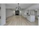 Spacious living area showcasing fireplace and open-concept kitchen at 5151 Tennis Ct, Las Vegas, NV 89120