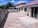 A charming backyard with red brick pavers, a wall and direct access to the home's interior at 5217 Yellow Dawn Ct, Las Vegas, NV 89130