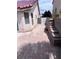 Cozy backyard featuring a hardscape design with red brick pavers and a small retaining wall at 5217 Yellow Dawn Ct, Las Vegas, NV 89130