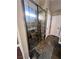 Bathroom featuring tiled walk-in shower with glass doors and built in seating at 5217 Yellow Dawn Ct, Las Vegas, NV 89130