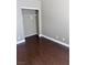 Cozy bedroom featuring dark wood flooring and a built-in closet at 5217 Yellow Dawn Ct, Las Vegas, NV 89130