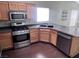 Functional kitchen with stainless steel appliances, ample counter space, and wood cabinetry at 5217 Yellow Dawn Ct, Las Vegas, NV 89130