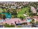 Expansive aerial shot overlooking the community's lush golf course, lake, pool, and well-maintained residential area at 5401 Indian Hills Ave, Las Vegas, NV 89130