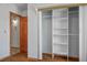 This bedroom has wood laminate flooring, a closet, and wood trim details at 5401 Indian Hills Ave, Las Vegas, NV 89130