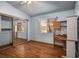 This bedroom includes a mirrored closet and a workstation with wood laminate flooring at 5401 Indian Hills Ave, Las Vegas, NV 89130