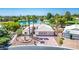 A charming one-story house features a three-car garage and lake in the background at 5401 Indian Hills Ave, Las Vegas, NV 89130