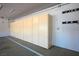 The garage includes storage cabinets and utility hooks for organization at 5401 Indian Hills Ave, Las Vegas, NV 89130