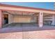 Spacious three car garage featuring built in storage and an attached service door at 5401 Indian Hills Ave, Las Vegas, NV 89130