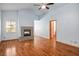 Spacious living room featuring wood floors, vaulted ceiling, and fireplace at 5401 Indian Hills Ave, Las Vegas, NV 89130