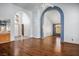 Inviting open-concept living room features an arched entryway and high ceilings at 5401 Indian Hills Ave, Las Vegas, NV 89130