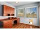 Home office features wood floors, built-in desk and cabinets, and bright light at 5401 Indian Hills Ave, Las Vegas, NV 89130