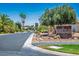 Street view featuring the Braemar Village community entrance sign, showcasing the landscaped surroundings at 5401 Indian Hills Ave, Las Vegas, NV 89130