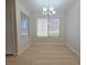 Bright dining room with natural light and wood flooring at 5710 E Tropicana Ave # 1018, Las Vegas, NV 89122