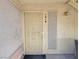 Close-up of the front door with security screen and unit number 1018 at 5710 E Tropicana Ave # 1018, Las Vegas, NV 89122
