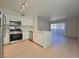 Modern kitchen with stainless steel appliances and dining area view at 5710 E Tropicana Ave # 1018, Las Vegas, NV 89122