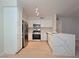 Bright kitchen with stainless steel appliances and breakfast bar island at 5710 E Tropicana Ave # 1018, Las Vegas, NV 89122