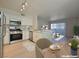 Modern kitchen with stainless steel appliances, and dining area at 5710 E Tropicana Ave # 1018, Las Vegas, NV 89122