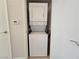 Functional laundry area features a stacked washer and dryer unit at 5710 E Tropicana Ave # 1018, Las Vegas, NV 89122