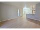 Open concept living area with light wood floors and natural light at 5710 E Tropicana Ave # 1018, Las Vegas, NV 89122