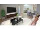 Bright living room with modern furniture and decor, adjacent to the open-plan kitchen at 5710 E Tropicana Ave # 1018, Las Vegas, NV 89122