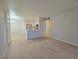 Open concept living area leading to kitchen and dining space at 5710 E Tropicana Ave # 1018, Las Vegas, NV 89122