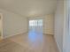 Open living space featuring sliding glass doors to a balcony, allowing plenty of light at 5710 E Tropicana Ave # 1018, Las Vegas, NV 89122