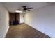 Comfortable living area with rustic fireplace and hardwood floors, ideal for relaxing and entertaining guests at 5920 Glen Eagles Ln, Las Vegas, NV 89108