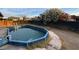 Backyard pool view showcasing the fenced-in area and surrounding greenery at 5920 Glen Eagles Ln, Las Vegas, NV 89108