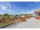 An upstairs balcony overlooks the backyard oasis with a swimming pool and mature trees at 6013 Jubilee Gardens Ave, Las Vegas, NV 89131
