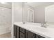 Clean bathroom featuring double sinks with modern fixtures, a large mirror, and a shower-tub combination at 6013 Jubilee Gardens Ave, Las Vegas, NV 89131