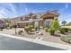 Two-story home with a well-manicured yard, three-car garage, complemented by a spacious driveway at 6013 Jubilee Gardens Ave, Las Vegas, NV 89131