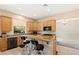 Stylish kitchen with granite countertops, breakfast bar, stainless steel appliances, and ample storage at 6013 Jubilee Gardens Ave, Las Vegas, NV 89131